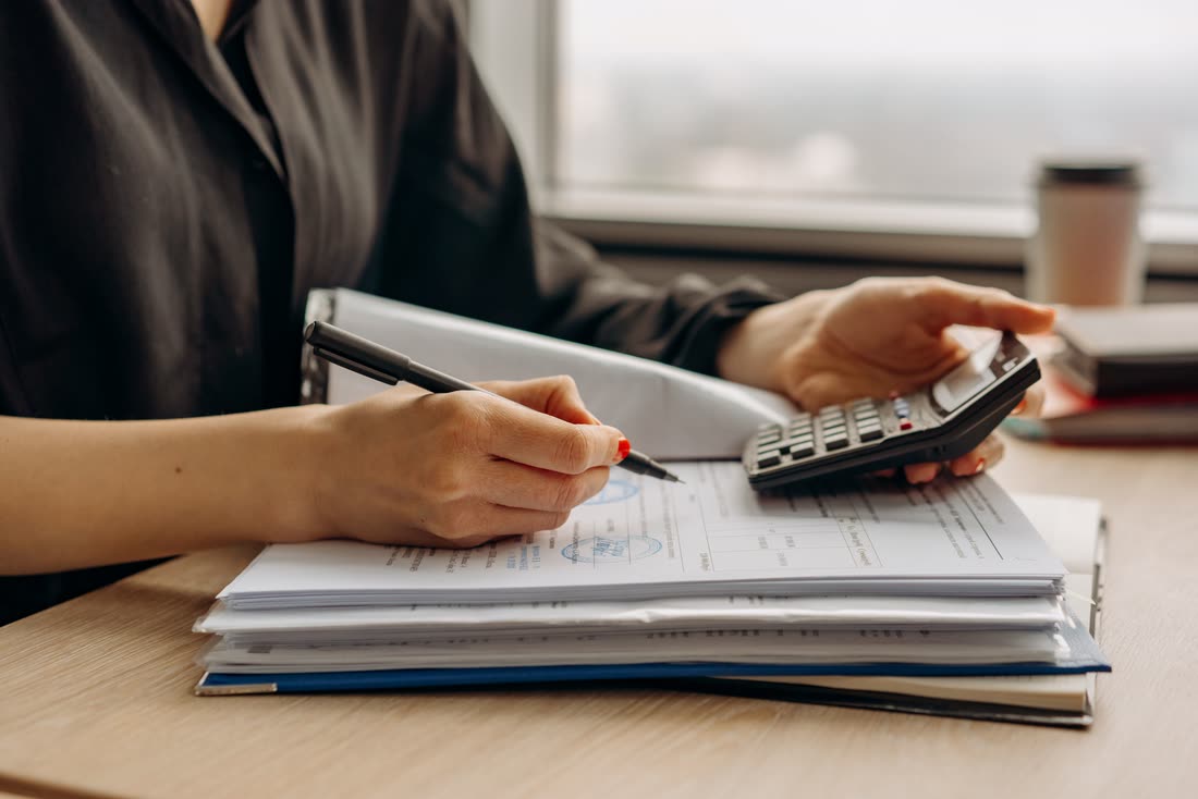 Working through the numbers with a calculator and paperwork