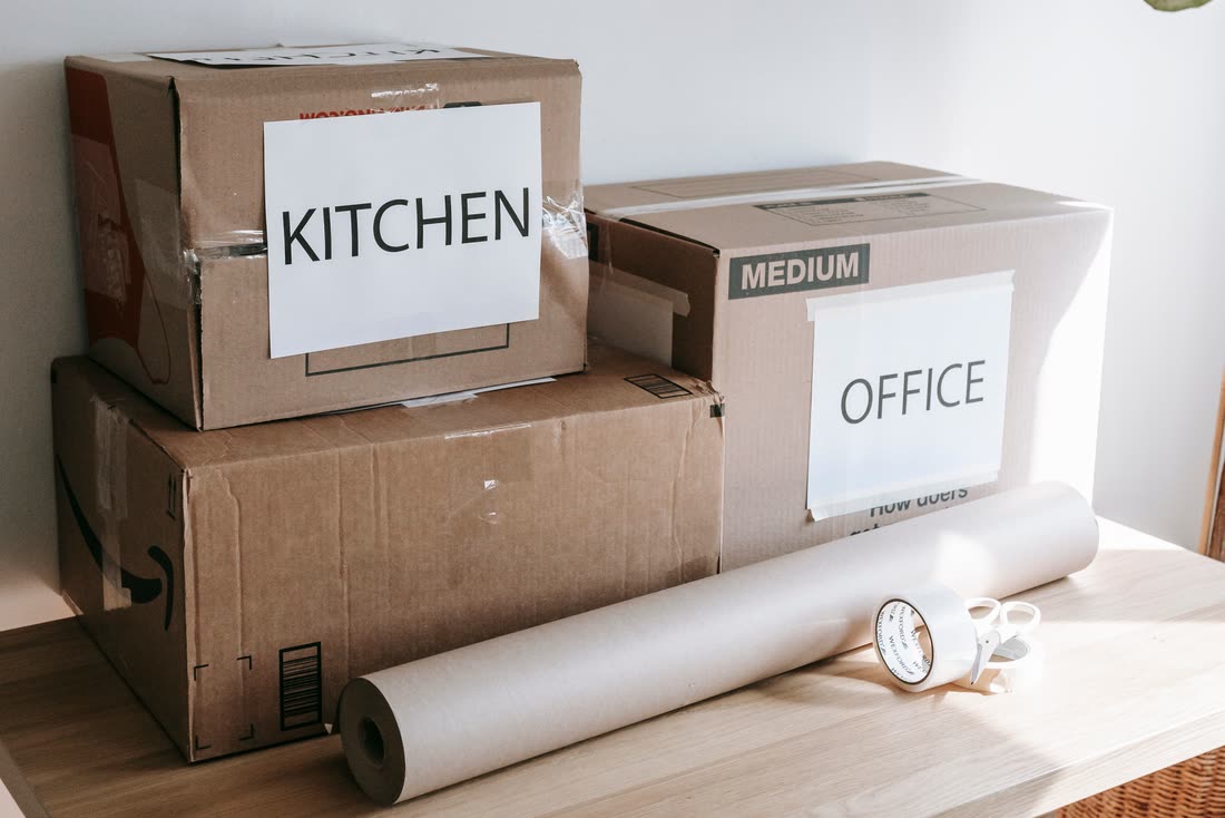 Labelled moving boxes ready for an office move